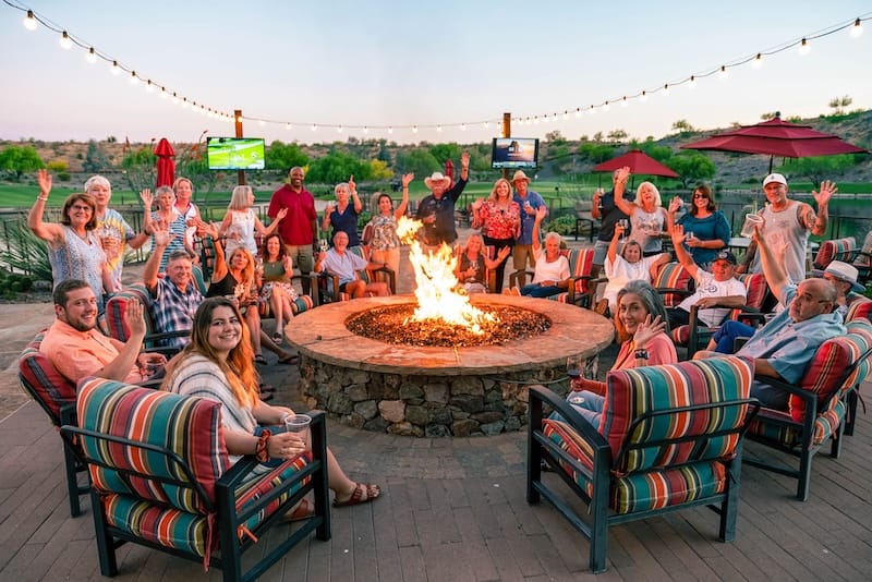 An image of an active adult community outdoor fire-pit depicting social connections and fun experiences